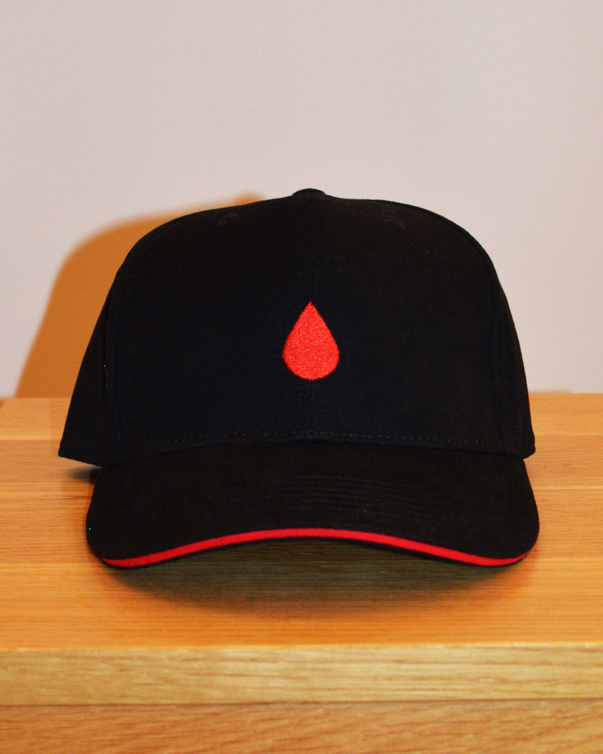 BLACK CAP | RED DROPLET